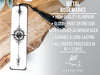 a metal bookmark with a black tassel on it