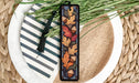 a bookmark with a design of leaves on it