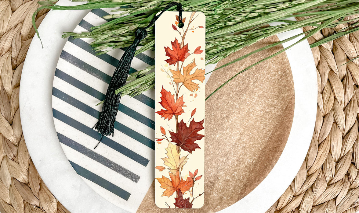 a wooden bookmark with a leaf design on it
