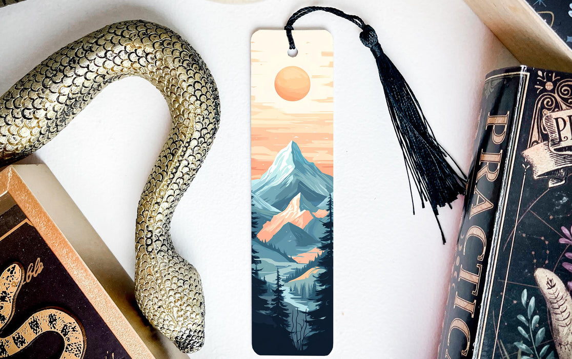 a bookmark with a picture of a mountain and a snake on it