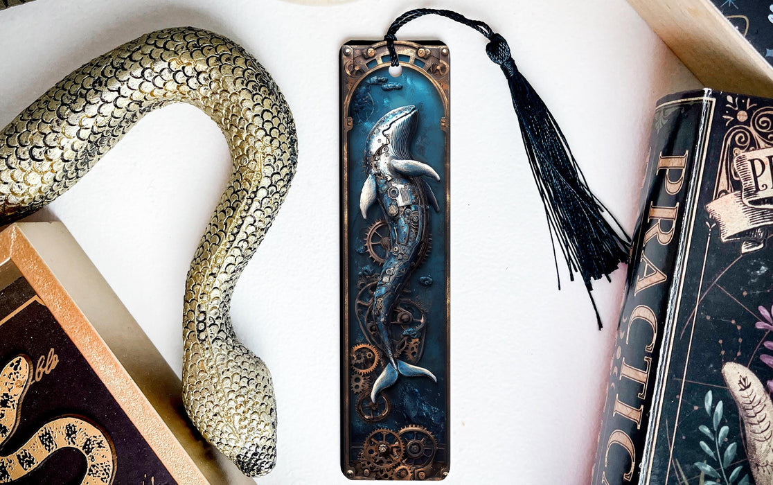 a bookmark with a mermaid on it next to books
