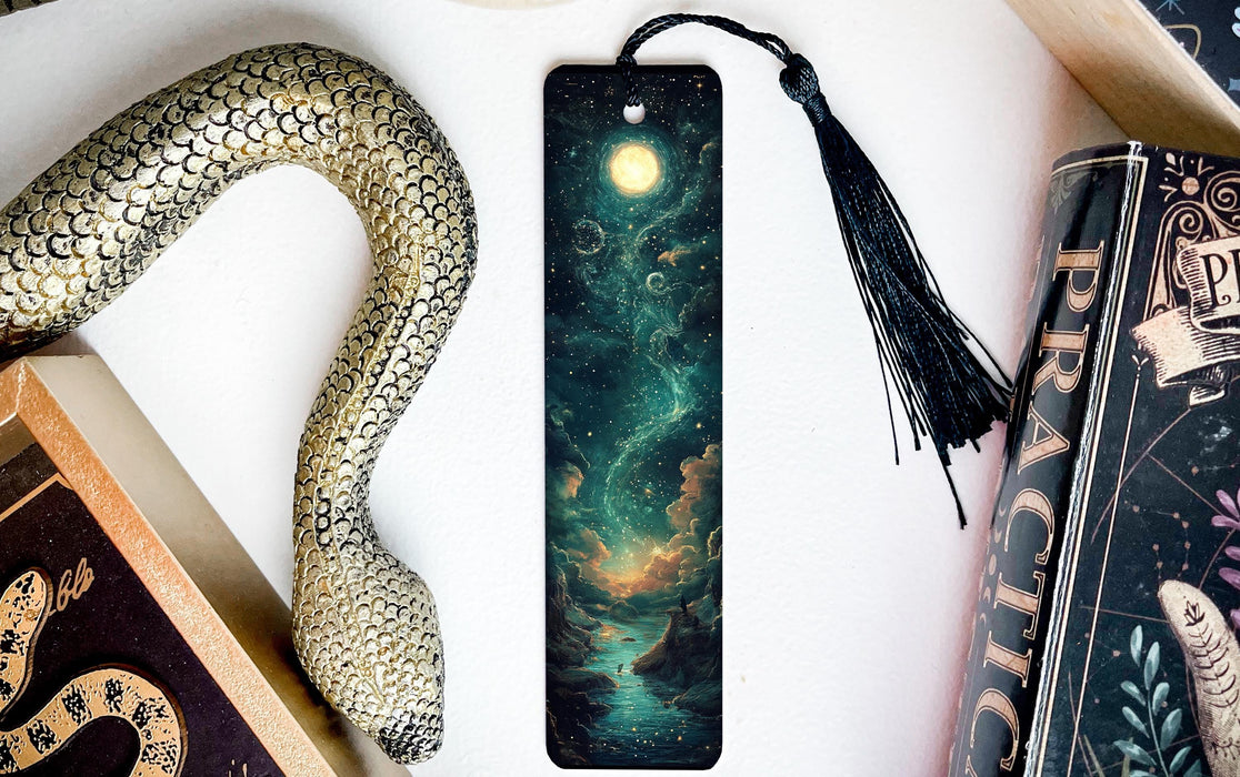 a bookmark with an image of a snake and a full moon