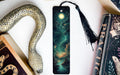 a bookmark with an image of a snake and a full moon