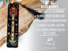 a metal bookmark with a cross on it