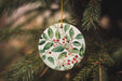 a ceramic ornament hanging from a christmas tree