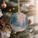 a christmas ornament hanging from a christmas tree