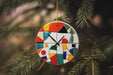 a colorful clock hanging from a christmas tree