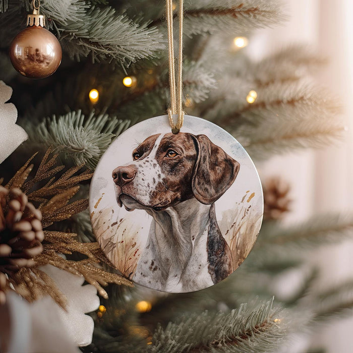 a brown and white dog ornament hanging from a christmas tree