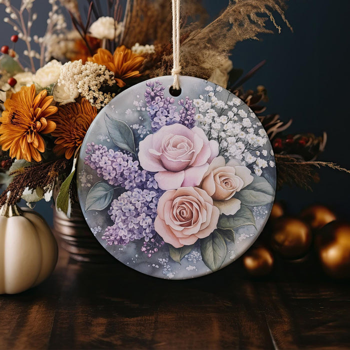 a ceramic ornament decorated with flowers and leaves