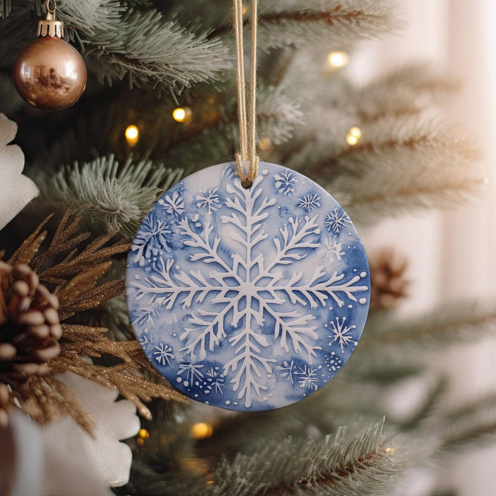 a snowflake ornament hanging from a christmas tree