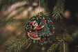 a christmas ornament hanging from a tree