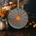 a blue plate with a red and yellow design on it