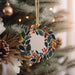 a christmas ornament hanging from a christmas tree