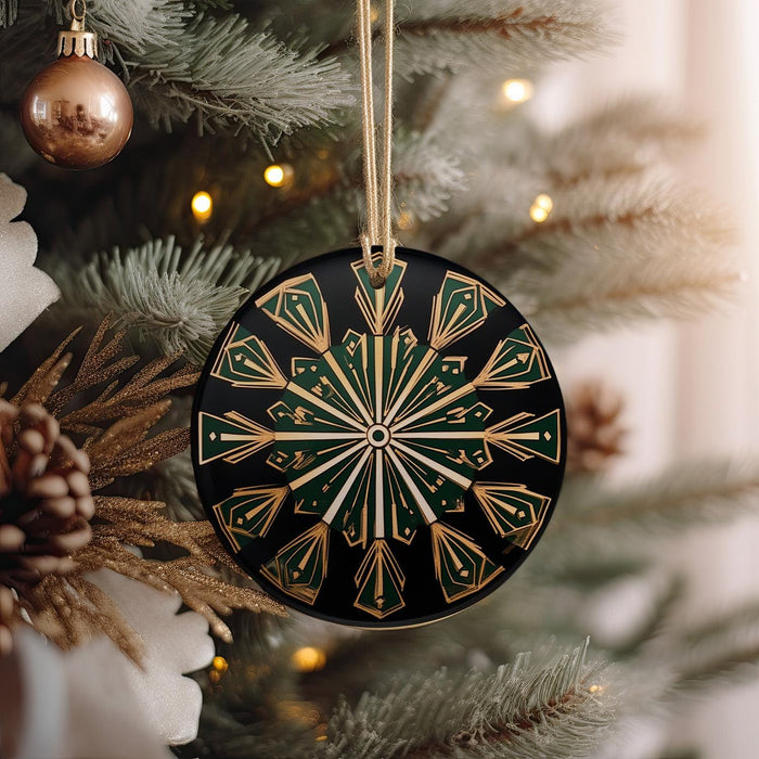 a black and gold ornament hanging from a christmas tree