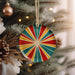 a christmas ornament hanging from a christmas tree