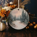 a christmas ornament with a winter scene on it