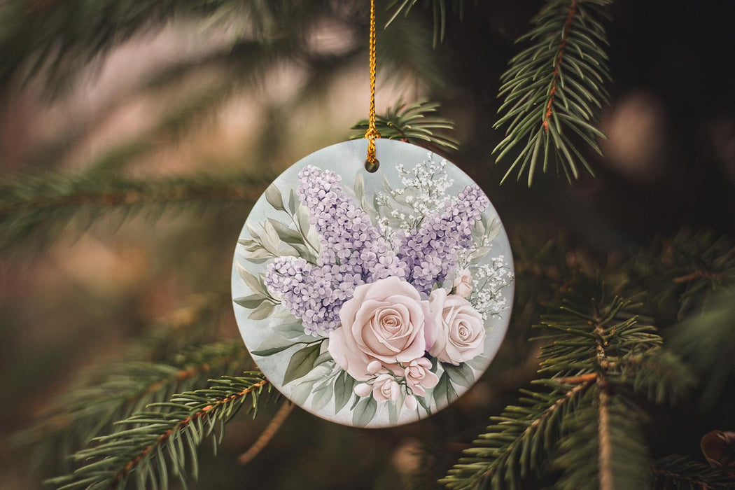 a ceramic ornament hanging from a christmas tree