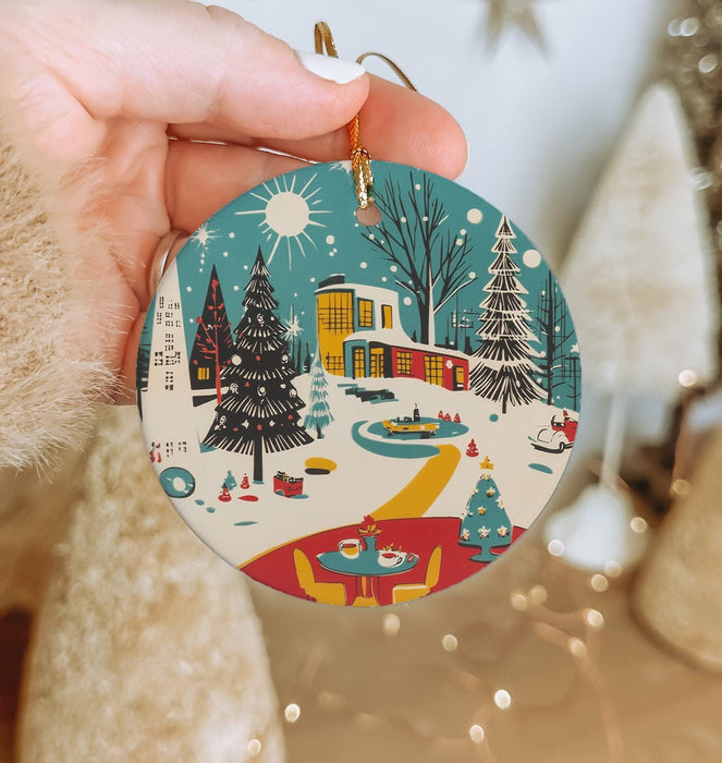 a person holding a christmas ornament in their hand