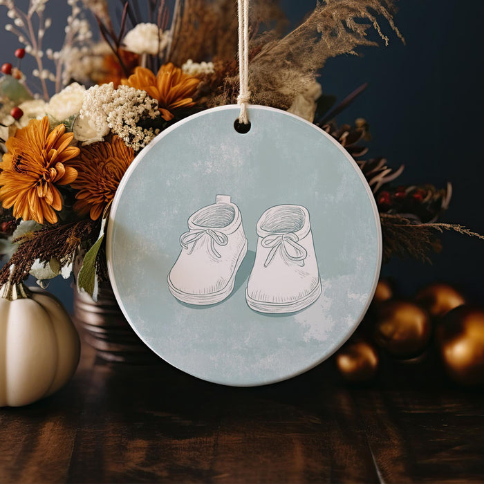 a ceramic ornament with a pair of shoes on it