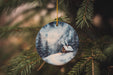 a christmas ornament hanging from a christmas tree