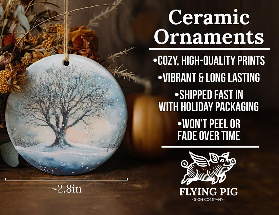 a ceramic ornament with a tree on it