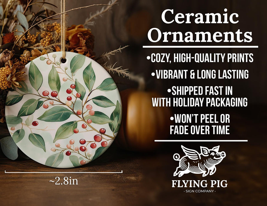 a ceramic ornament with holly and berries on it