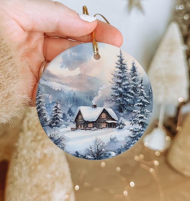 a person holding a christmas ornament in their hand