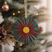 a christmas ornament hanging from a christmas tree
