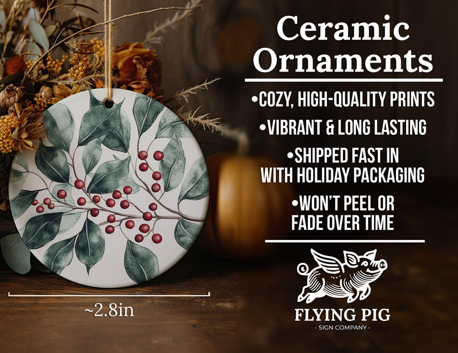 a ceramic ornament with holly and berries on it