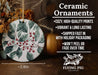 a ceramic ornament with holly and berries on it