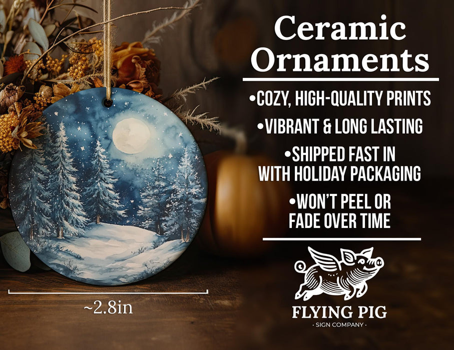 a ceramic ornament with a snowy scene on it