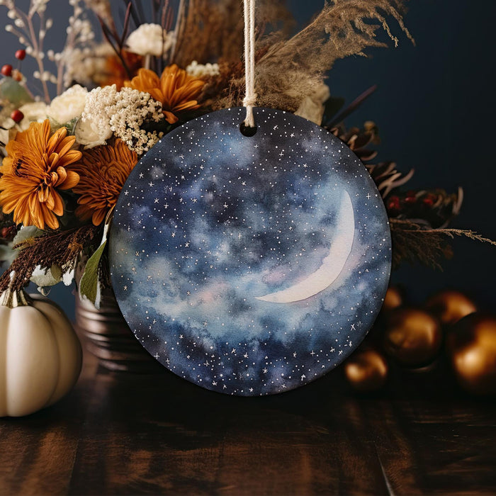 a ceramic ornament with a picture of the moon on it