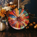 a colorful plate sitting on top of a wooden table