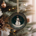 a christmas ornament hanging from a christmas tree