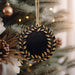 a christmas ornament hanging from a christmas tree