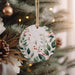 a christmas ornament hanging from a christmas tree