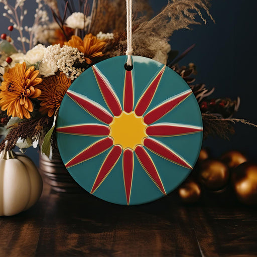 a vase filled with flowers and a sunburst ornament