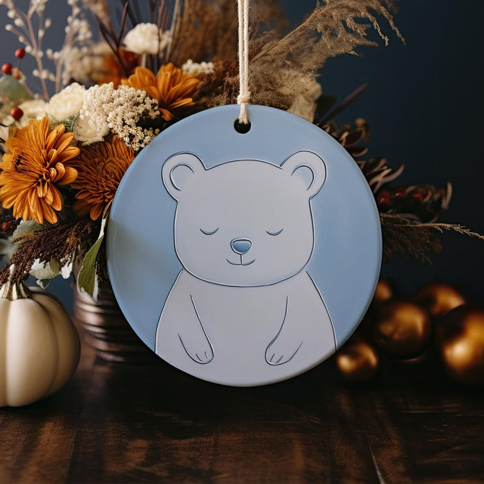 a blue ornament with a white bear on it