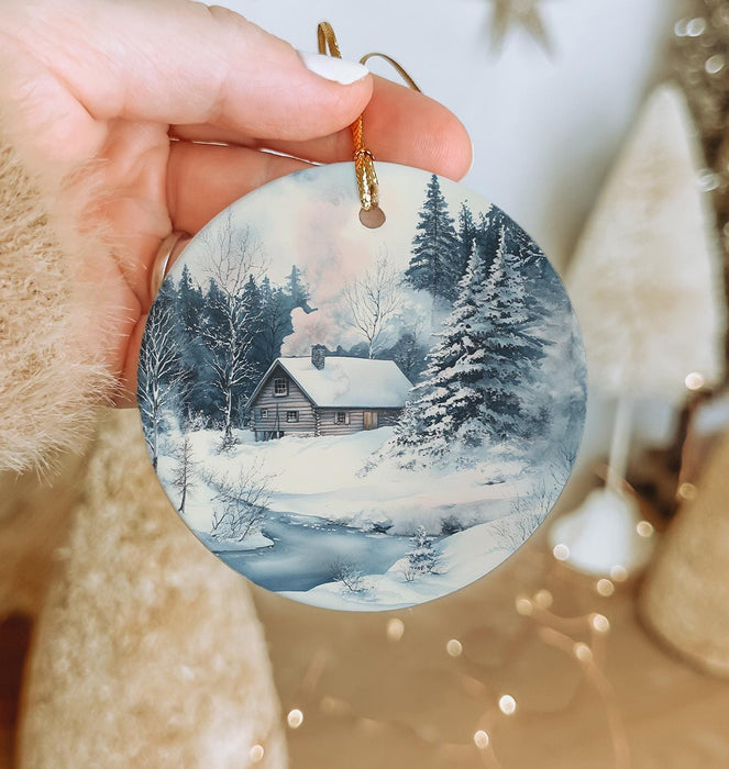 a person holding a christmas ornament in their hand
