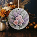 a ceramic ornament with a bouquet of flowers on it