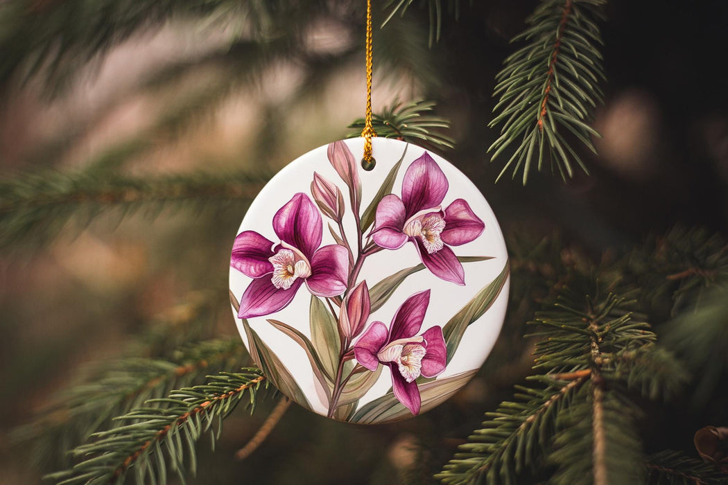 a ceramic ornament hanging from a christmas tree
