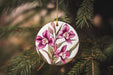 a ceramic ornament hanging from a christmas tree