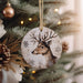 a christmas ornament hanging from a christmas tree