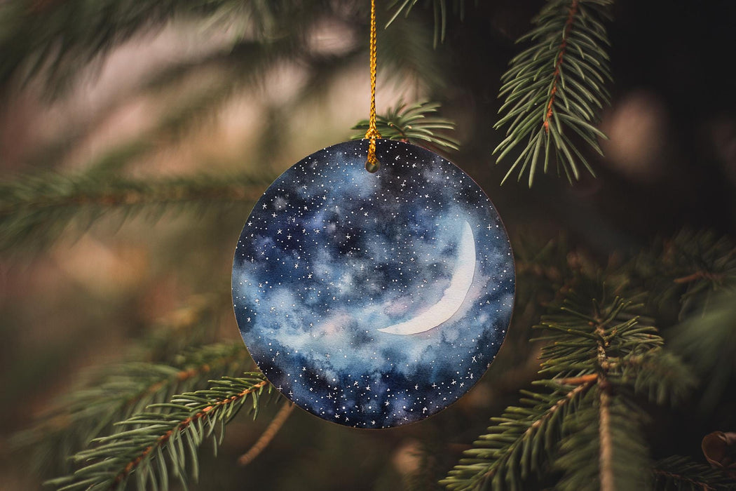 a glass ornament hanging from a christmas tree