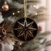 a star ornament hanging from a christmas tree