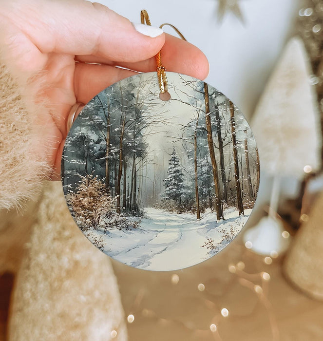 a person holding a christmas ornament in their hand