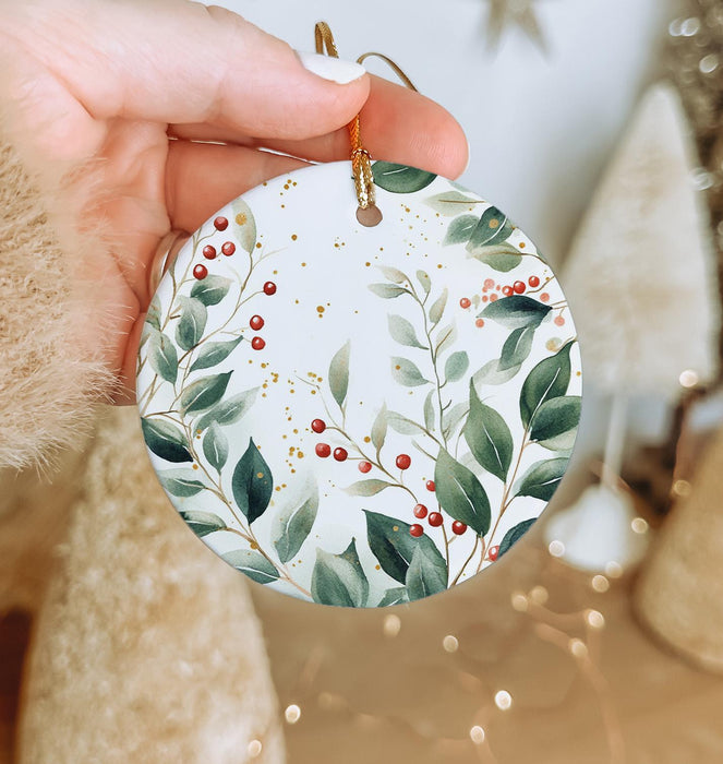 a person holding a christmas ornament in their hand