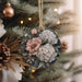 a close up of a christmas ornament on a tree