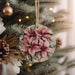 a christmas ornament hanging from a christmas tree
