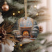 a christmas ornament hanging from a christmas tree
